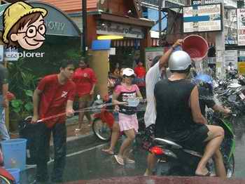 Songkran revellers soak motorcyclist