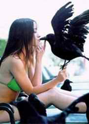 Girl kissing a bird