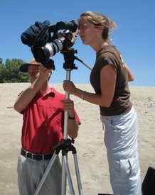 film crew on the beach