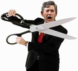 Gordon Brown weilding scissors