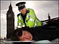 Haw forced to teh ground by police outside parliament