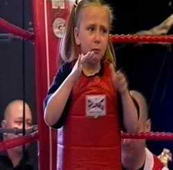 Thai kick boxing kid looking apprehensive