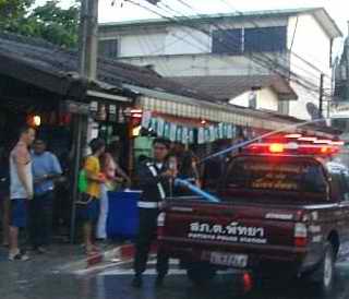 Policeman confiscating water cannon